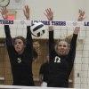 Dulaney Jones and Bailey Kerby guard the net against Tulare Union.
